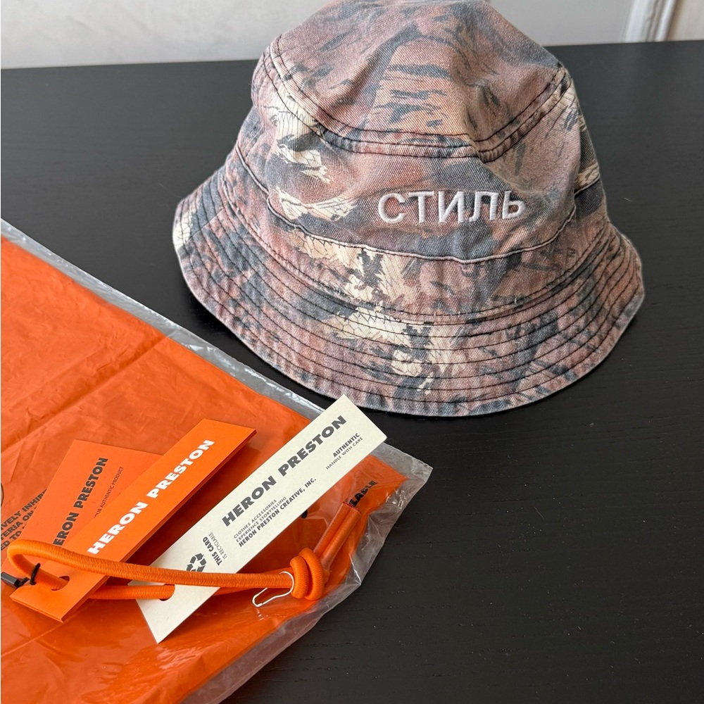 Heron Preston Orange and Gray Patterned Bucket Hat.  the size of a medium